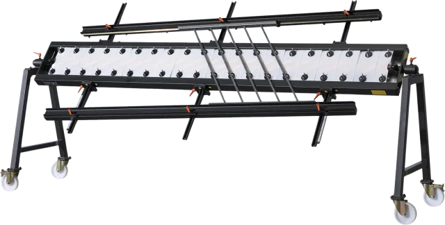 Mobile CREAMETAL welding jig with roller support and clamps, cut out against a white background